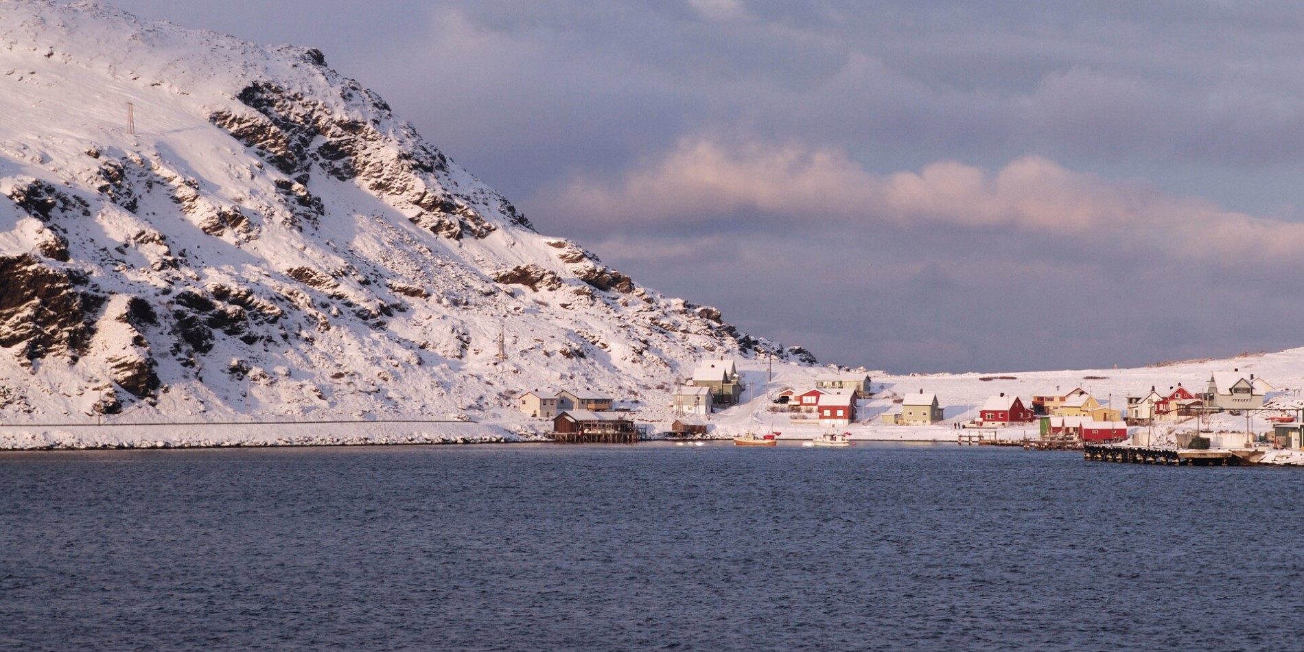 The small port of Havøysund in Norway covered in snow